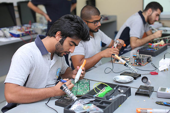 Students working on aircraft electrical systems